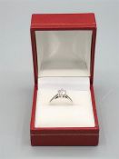 An 18ct white gold single stone diamond ring of 82 points