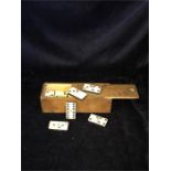 A boxed set of bone and ebony vintage dominoes