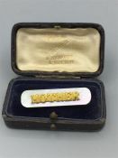 A boxed brooch, 'Mother'