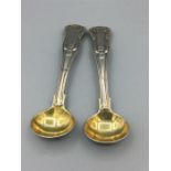 Two Georgian silver, Kings Pattern salt spoons partly guilded
