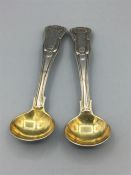 Two Georgian silver, Kings Pattern salt spoons partly guilded