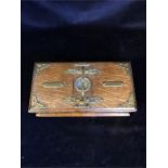 An oak cigar and cigarette box with integral cutter
