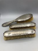 Three silver backed ladies dressing table brushes, hallmarked Birmingham 1920