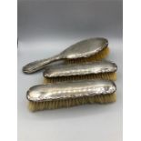 Three silver backed ladies dressing table brushes, hallmarked Birmingham 1920