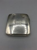 A silver cigarette case , intertwined initials CAC to the front and engraved 12th November 1928 to