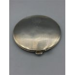 A silver powder compact 31/2" diameter, engine turned with some plain work on lid, marked b & Co