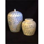 Two decorative Chinese style blue and white jars.