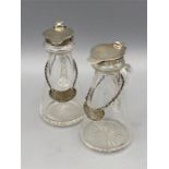 A pair of water jugs for whisky with hallmarked silver pourers and tags.