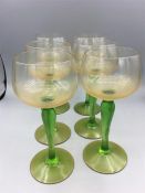 A set of six vintage green stemmed wine glasses