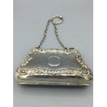 A Chatalaine silver Roccoc purse with Repousse decoration 41/2" x 21/3", hallmarked Birmingham 1905