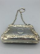 A Chatalaine silver Roccoc purse with Repousse decoration 41/2" x 21/3", hallmarked Birmingham 1905