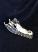 A Chrome crocodile skull