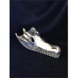 A Chrome crocodile skull