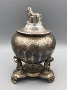 A silver plated tobacco jar.by Phillip Ashby