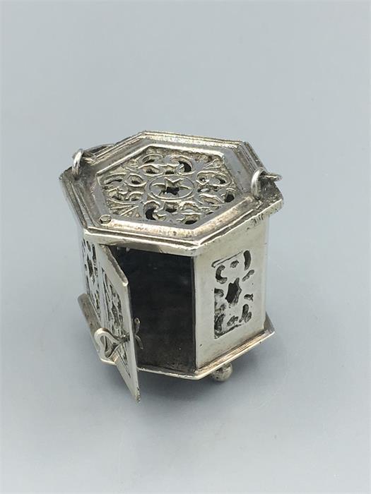 A silver miniature, hexagonal in shape, with carrying handle and opening door, pierced decoration - Image 2 of 2