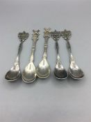 A selection of Dutch silver teaspoons, five in total.