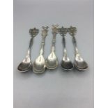 A selection of Dutch silver teaspoons, five in total.