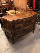 A Serpentine fronted chest of three drawers