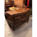 A Serpentine fronted chest of three drawers