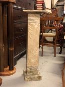 A marble effect, wooden plinth,