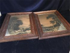 A pair of prints in carved frames