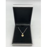A 14ct white gold citrine and diamond heart shaped pendant necklace