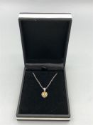 A 14ct white gold citrine and diamond heart shaped pendant necklace