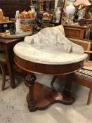 A mahogany marble topped washstand