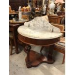 A mahogany marble topped washstand