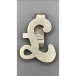 A silver pound sign hallmarked money clip
