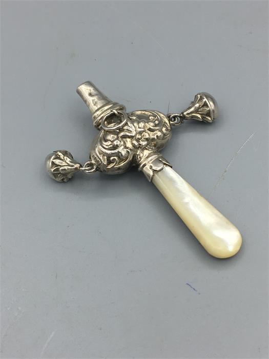 A mother of pear handled babies rattle in silver - Image 2 of 2