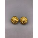 Chanel goldtone quilted texture clip on style earrings from the early 1980's. The round earrings