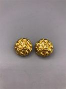 Chanel goldtone quilted texture clip on style earrings from the early 1980's. The round earrings