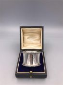 A silver boxed napkin ring, hallmarked Chester 1916-17