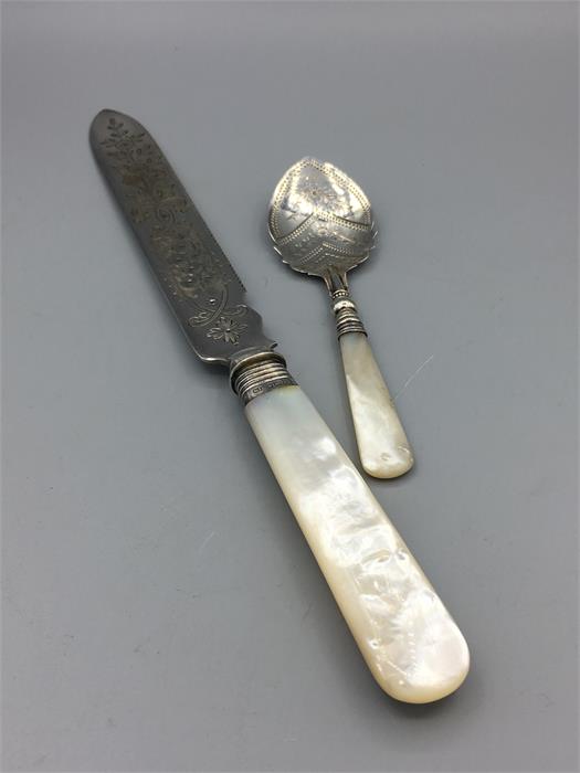 A mother of pearl handled knife and jam spoon