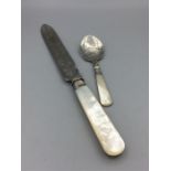 A mother of pearl handled knife and jam spoon