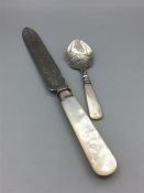 A mother of pearl handled knife and jam spoon