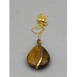 A 9ct yellow gold Tigers eye pendant necklace on gold chain