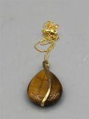 A 9ct yellow gold Tigers eye pendant necklace on gold chain