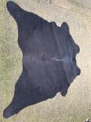 A black and dark brown cowhide