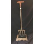 A Long handled boot scraper and brush