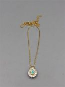 An opal and diamond pendant on an 18ct gold chain