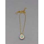 An opal and diamond pendant on an 18ct gold chain