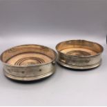A pair of hallmarked silver wine coasters