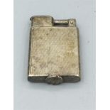 A silver lighter hallmarked 925, dated 9.6.28