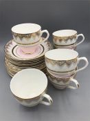 Imperial pale pink and embossed with 22ct gold six tea cups and saucers along with six side plates.