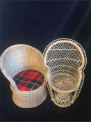 A pair of vintage dolls chairs in wicker.