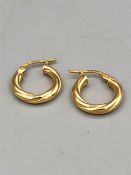 A pair of 9ct gold earrings