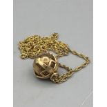 A Masonic gold orb on a 9ct gold chain (20g)