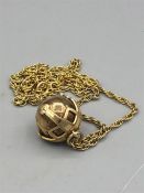 A Masonic gold orb on a 9ct gold chain (20g)